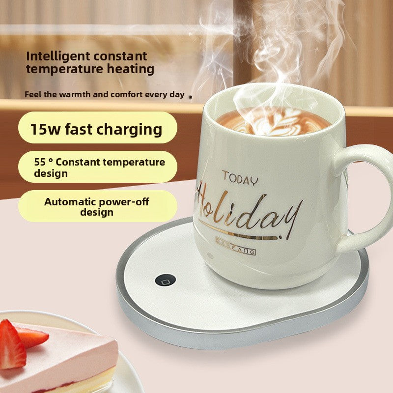 White constant temperature USB mug warmer on a wooden desk with a steaming white ceramic mug.